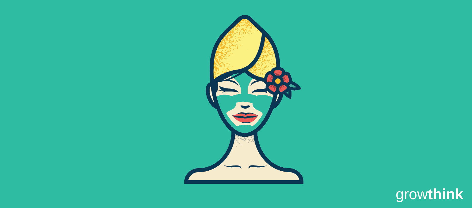 Girl with a beauty face mask, towel on her hair and a flower behind her ear